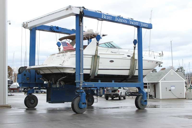 Motor Yacht be moved in slings on marine travel lift at Bert Jabin's Yacht Yard - Located in Annapolis, MD.