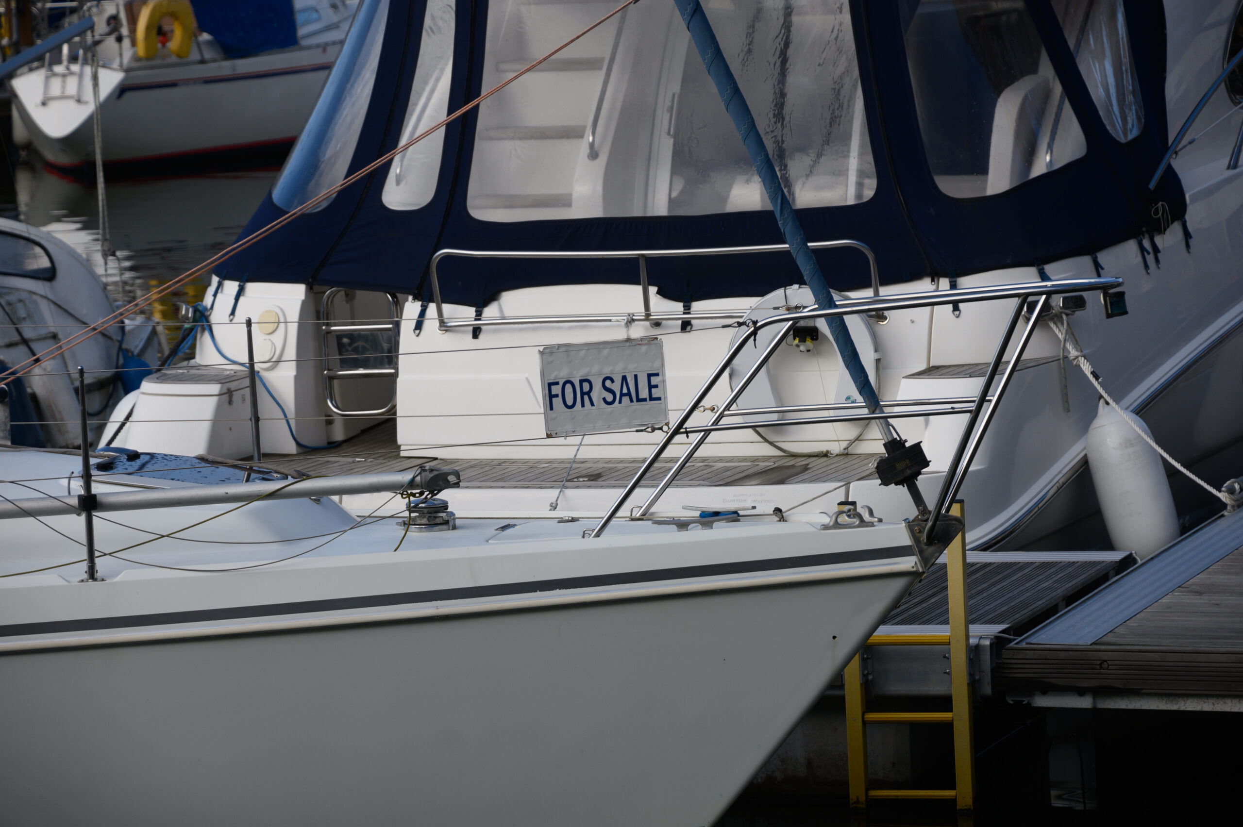 Yacht for sale in marina A yacht for sale in a marina